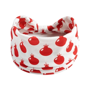 Close-up of soft white yoga headband with vibrant red pomegranate patterns for women