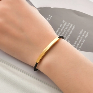Minimalist black braided rope bracelet with curved gold stainless steel bar for couples