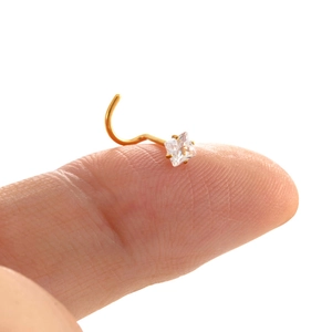 Gold 3mm square zircon stainless steel nose stud shown on fingertip for size perspective