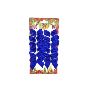 Detail showing twelve blue metallic Christmas tree bows arranged on a festive display card