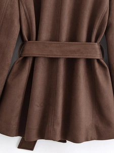 Close-up of brown faux suede coat with adjustable waist belt and detailed stitching