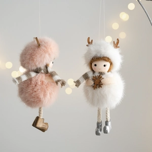 Detail of plush Christmas angel dolls with fur hats, wooden antlers and knit scarves