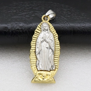 Detail of silver and gold Virgin Mary religious pendant with metallic luster