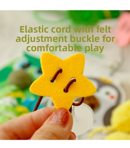 Detail of elastic cat toy cord with star-shaped felt adjustment buckle and suction cup