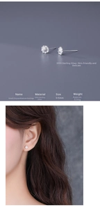 Macro detail of S999 sterling silver daisy stud earrings showing fine floral textures