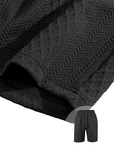 Detail of black waffle knit fabric and stitching on men's retro athletic shorts