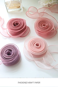 Close-up of Morandi colored organza ribbons with stitched edges for floral wrapping