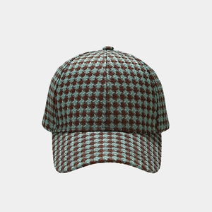 Detailed view of vintage houndstooth pattern on a stylish six-panel baseball cap