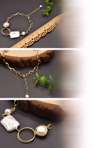 Detail of 18K gold plated chain with natural freshwater baroque pearls and extension link