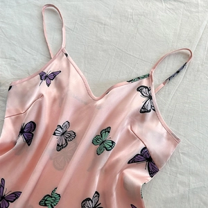 Pink satin three-piece pajama set with butterfly prints and thin spaghetti straps