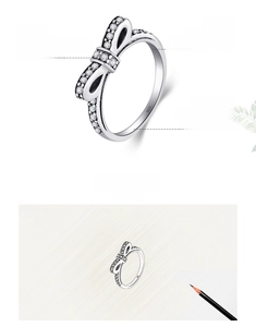 Macro detail of S925 sterling silver bow ring with micro-set 5A cubic zirconia stones