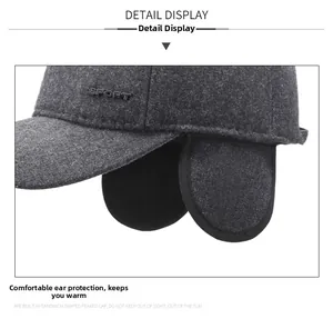 Detail view of winter wool baseball cap with ear flaps and SPORT embossed logo