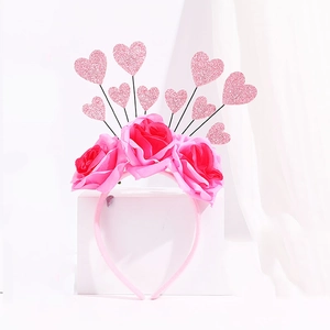 Detail of pink floral headband featuring glittery hearts and roses for Valentine's Day
