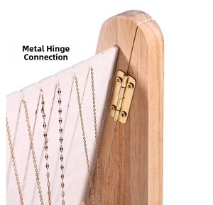 Close-up of double-row necklace display stand with gold metal hinges and velvet lining