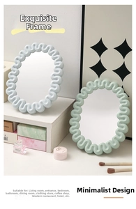 Detail of wavy frame desktop makeup mirrors in soft pastel green and blue shades