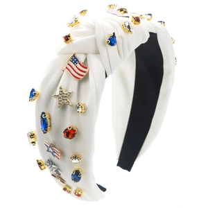 Detail of white knotted headband with sparkling rhinestones and US flag star motifs