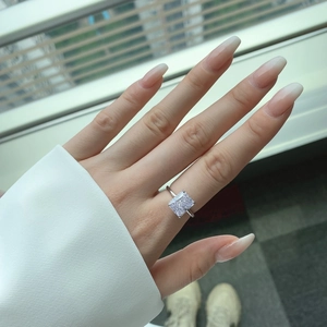 Close-up of S925 silver ring with a square-cut ice flower cubic zirconia on a finger