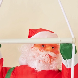 Hanging Santa Claus on climbing ladder with red fabric suit and white festive rope
