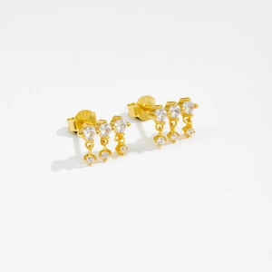 Macro shot of S925 sterling silver gold earrings featuring three-row cubic zirconia stones