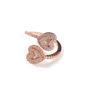 Detailed view of rose gold double heart ring with micro-pave cubic zirconia crystals