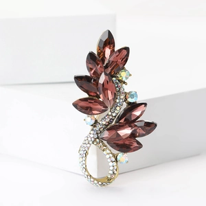 Close-up of elegant flower brooch with brown marquise crystals and rhinestones