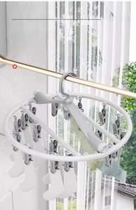 Close-up of circular laundry drying rack with multi-clips for socks and underwear