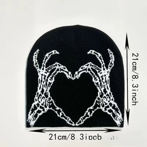 Black knit beanie detail with white skeleton hands heart jacquard and 21cm measurement