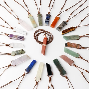 Handcrafted necklace featuring various natural crystal stone pendants on woven cords
