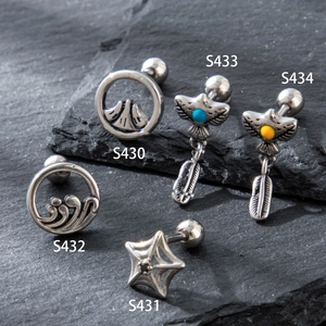 Set of stainless steel ear studs with spider web, feather, and eagle designs