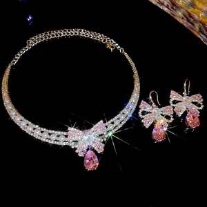 Luxurious zircon bow jewelry set with pink pear-shaped gems and double-row pearls