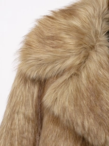 Detailed close-up of soft brown faux fur texture and collar on a stylish short jacket