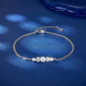 Detail view of S925 sterling silver double-layer bracelet with pearls and zircon beads