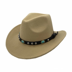 Detail of khaki felt cowboy hat featuring black leather band with turquoise and silver studs