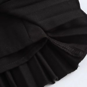 Fashionable black wide pleated skirt for women featuring high-quality fabric and texture detail