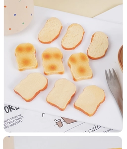 Miniature PVC toast slices and French bread models arranged for DIY accessory making