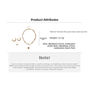 Detailed view of tiger eye stone jewelry set with steel necklace and round earrings