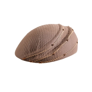 Elegant brown wool felt pillbox hat with vintage mesh veil and beaded wave trim detail
