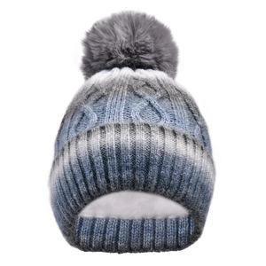 Detail of gradient knit hat with faux fur pom and thick white fleece lining