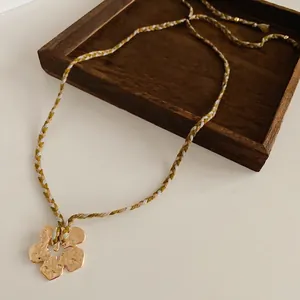 Handmade gold flower pendant necklace with adjustable colorful woven rope for women