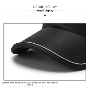 Detailansicht der schwarzen Basecap-Krempe mit reflektierender Paspel und robusten Nähten