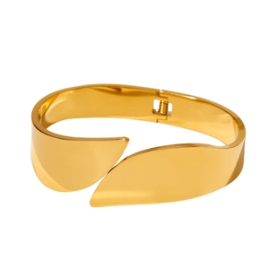 Polished gold wide open bangle with overlapping leaf design and spring hinge closure
