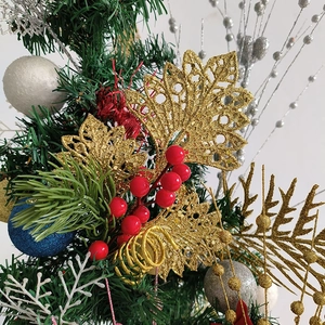 Golden Christmas tree branches with red berries and glitter leaves for holiday decoration