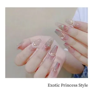 Long trapezoid press-on nails with pink gradient, pearls, and golden 3D metallic line accents