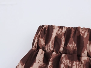 Close-up of the elastic waistband on leopard print wide-leg trousers for women