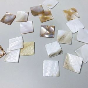 Square natural mother of pearl shell inlay pieces with iridescent pearl white finish
