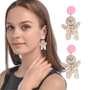 Gingerbread man acrylic earrings with pink studs and marble texture on white background