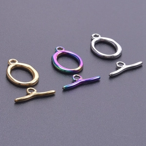 Detailed macro view of gold, rainbow, and silver stainless steel toggle clasps for DIY jewelry