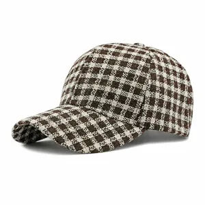 Classic checkered baseball cap in brown and cream tweed with a structured curved brim