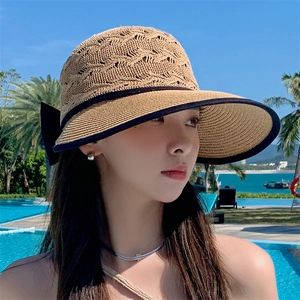 Women's foldable straw sun hat with black bow and edge, stylish outdoor beach headwear