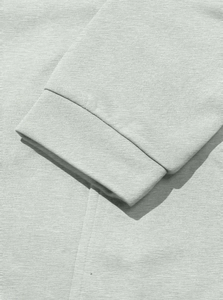 Detailed view of the light grey ribbed knit cuffs on a slim fit men's hooded trench coat